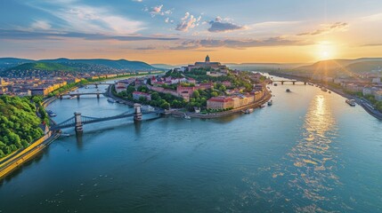 Wall Mural - Aerial view of the Danube River flowing through Budapest, Hungary, with the historic Buda Castle and Chain Bridge visible