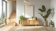 © EMRAN - Modern entryway with wooden stairs and a light wood console table, a large window, white walls, natural lighting, plants, a modern art frame hanging above the cabinet.