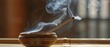 Spirituality background concept, spiritual ritual - Smoking and smelling joss stick in a bowl at home, feng shui
