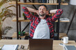 © InsideCreativeHouse - Relaxed young man resting from work on laptop holding hands behind head lean on comfy chair closing eyes feels serenity in home office workplace coworking. Taking Break no stress, fatigue relief