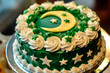 green cake decorated with moon and stars