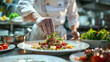 © somruethai - gourmet dish being prepared in a high-end restaurant kitchen