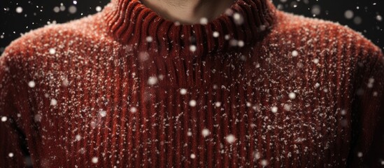 Indoor closeup of a man s sweater with dandruff flakes visible Plenty of room for adding text. Copyspace image