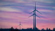 Wind turbines in the countryside in front of the colorful sky at dawn