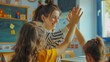 © The Little Hut - Happy elementary school teacher giving highfive to her student during class in the classroom : Generative AI