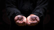© john - close up of male hands begging or holding something over black background