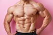© Ilja - Muscular bodybuilder with defined abs on soft colored background, space for text