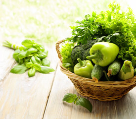 Poster - fresh organic green vegetables in basket