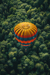 Poster - Aerial shot of a jumper with a brightly colored parachute opening above a dense forest,