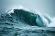 Blue ocean wave with white foam and water splashes close-up