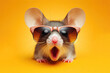 © Anna - Surprised photo mouse wearing sunglasses Isolated on yellow background