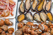 raw mussels and clams, seafood, street food, selective focus