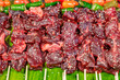 grilled beef slices with sesame seeds, street food, selective focus