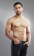 Poster - Asian man, muscle and portrait or fitness confidence with strong stomach in studio, grey background or progress. Male person, abs and shirtless for weight loss goals or athlete target, results or gym