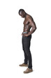 side view of a portrait of shirtless man look down and armas akimbo on white background
