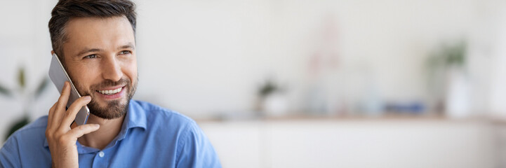 Poster - Phone Call. Closeup Shot Of Handsome Millennial Man of Talking On Cellphone, Enjoying Mobile Communication, Having Pleasant Conversation, Looking Away And Smiling, Selective Focus, Copy Space