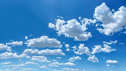 Wall Mural - Sky is blue with many clouds. The clouds are scattered throughout the sky