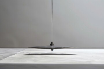 Aufkleber - A metal object hanging from the ceiling, suitable for industrial or interior design concepts