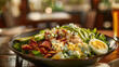 Cobb salad with mixed greens, grilled chicken, avocado, bacon, eggs, and blue cheese dressing