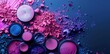 A collection of colorful makeup products on an abstract background.