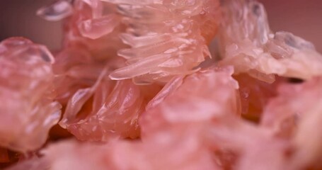 Canvas Print - peeled red and pink pomelo on the table, citrus pomelo peeled and folded on the table