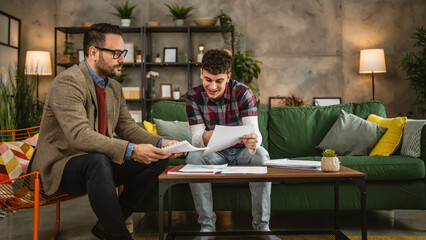 Adult professor mentor hold book and explain young student lesson