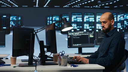 Poster - system admin focused on programming in server farm housing advanced equipment storing massive datase