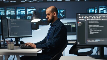Poster - computer scientist programming in high tech facility with server rows providing computing resources 