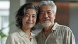 © PatternHousePk - Happy smiling asian mature senior couple posing together