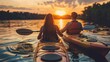 © zipop - couple kayaking on the lake together at sunset. Have fun in your free time