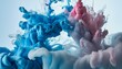 Photo of a splash of blue and pink paint on a white background
