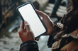 Mobile screen mockup template over shoulder view of a woman using a smartphone