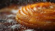 © aicandy - Close-up of a beautifully caramelized orange tart glistening under sugary sprinkles in artistic food photography