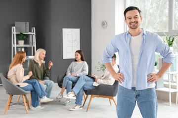 Wall Mural - Handsome man at group therapy session