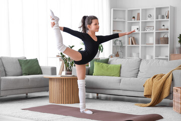 Poster - Little girl doing gymnastics at home