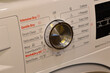 © TeacherPhoto - The washing machine buttons are surrounded by various functions, allowing for customized washing cycles tailored to your laundry needs.