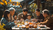 © khonkangrua - A happy multigenerational Asian family gathers around a festive table, enjoying a meal together in a cozy outdoor setting.
