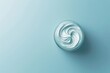 © Barra Fire - Skincare jar with cosmetic anti aging cream swirl texture and lid isolated on pale blue background. Hyaluronic acid moisturizer product