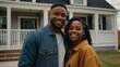 © VistaVisions - Happy young married black african american couple standing in front of their new house, concept of real estate, house sale buying