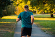 © Malik Nalik - Sporty man running or jogging at the park active healthy lifestyle.