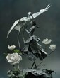 The photo is an origami sculpture of a woman in a kimono with a crane