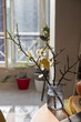 Branches of blossoming plum in a vase in the interior