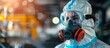 © ETAJOE - A woman in a hazmat suit is wearing a gas mask