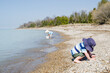 Young Children playing with buckets on a Lake Huron beach