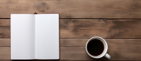Poster - A copy space image of a notebook styled with a tablet and coffee placed on a wooden surface