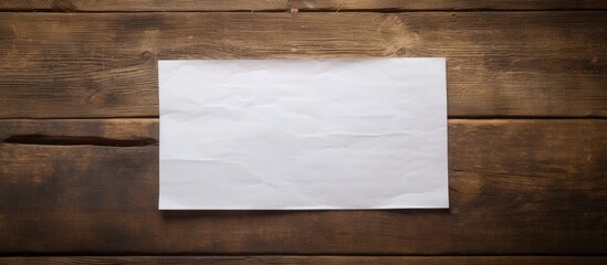Poster - An image of note paper on an aged wooden table with ample copy space
