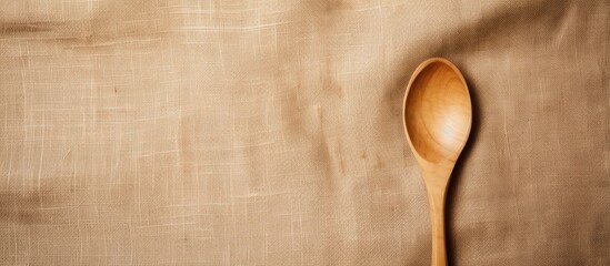 Aufkleber - Top view of a copy space image featuring a wooden spoon and fork placed on a background of sackcloth