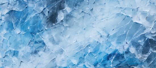 Poster - Close up of a frozen river with cracked ice covered in white snow and revealing the deep blue water underneath This copy space image showcases the texture of the ice