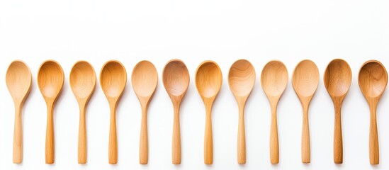 A simple and clean image showcasing wooden spoons on a white background with plenty of copy space