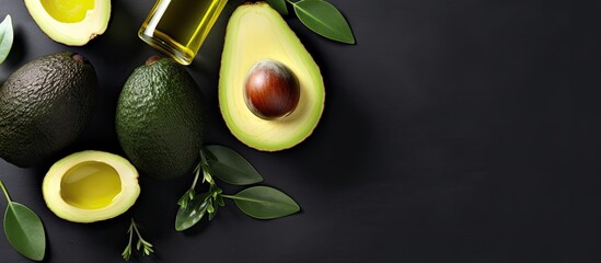 Poster - Top view copy space image of bottles containing avocado oil alongside slices of avocado on a grey background showcasing natural skin care products